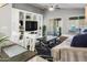 Cozy living room with comfortable seating, a ceiling fan, and a seamless flow to the kitchen at 4704 E Melinda Ln, Phoenix, AZ 85050