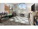 Bright playroom with natural light, a checkerboard rug and plenty of space for activities at 4704 E Melinda Ln, Phoenix, AZ 85050