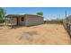 Spacious dirt lot with a covered back patio at 5029 W Osborn Rd, Phoenix, AZ 85031