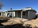 View of covered back patio and brick-paved area perfect for outdoor enjoyment at 5029 W Osborn Rd, Phoenix, AZ 85031