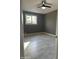 Bright bedroom with modern ceiling fan, and gray walls at 5029 W Osborn Rd, Phoenix, AZ 85031