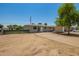 Charming single-story home featuring a well-maintained front yard and a welcoming entrance at 5029 W Osborn Rd, Phoenix, AZ 85031