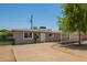 Charming single-story home featuring a well-maintained front yard and a welcoming entrance at 5029 W Osborn Rd, Phoenix, AZ 85031