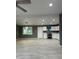 Bright kitchen featuring white cabinets, stainless appliances, and modern hanging lights at 5029 W Osborn Rd, Phoenix, AZ 85031