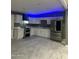 Modern kitchen with stainless steel appliances, quartz countertops, and eye catching vent hood at 5029 W Osborn Rd, Phoenix, AZ 85031