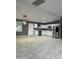 Spacious kitchen with sleek stainless steel appliances, gray walls, and modern lighting at 5029 W Osborn Rd, Phoenix, AZ 85031