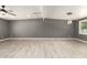 Spacious living room showcasing light tile floors, a modern ceiling fan and recessed lighting at 5029 W Osborn Rd, Phoenix, AZ 85031