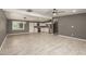 Large living area showcases an open concept into the kitchen, with tiled floors, recessed lighting, and a ceiling fan at 5029 W Osborn Rd, Phoenix, AZ 85031