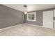 Bright living room space features tiled floors, recessed lighting and modern light fixture above a dining space at 5029 W Osborn Rd, Phoenix, AZ 85031