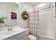 Well-lit bathroom features a vanity with framed mirror, a shower and tub combination at 5661 S Dante --, Mesa, AZ 85212