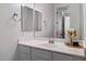 Bright bathroom featuring a modern vanity with a white countertop and a chrome faucet at 5661 S Dante --, Mesa, AZ 85212