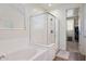 Modern bathroom featuring a glass shower and a luxurious soaking tub with tiled surround at 5661 S Dante --, Mesa, AZ 85212