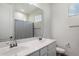 Bathroom showcasing a double vanity with a large mirror and a shower and tub combination at 5661 S Dante --, Mesa, AZ 85212
