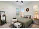 Cozy bedroom features a comfortable queen size bed, side tables with lamps and multiple windows at 5661 S Dante --, Mesa, AZ 85212