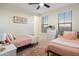 Charming ' bedroom with two twin beds, dresser, soft rug, and natural light at 5661 S Dante --, Mesa, AZ 85212