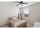 Cozy bedroom with a neutral color scheme, a window providing natural light, and a comfortable bed at 5661 S Dante --, Mesa, AZ 85212