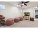 Spacious bonus room with a media center, plush seating, and a view into the Bedroom room at 5661 S Dante --, Mesa, AZ 85212