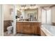 Bright bathroom featuring a double sink vanity, soaking tub, and tile surround at 5912 W Gail Dr, Chandler, AZ 85226