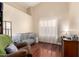 Bright Bedroom with a modern crib, hardwood floors, high ceilings, and natural light at 5912 W Gail Dr, Chandler, AZ 85226