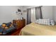 Cozy bedroom featuring a dresser, hardwood floors, chair and natural light at 5912 W Gail Dr, Chandler, AZ 85226
