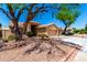 Charming home with desert landscaping, mature trees, and a convenient three-car garage at 5912 W Gail Dr, Chandler, AZ 85226