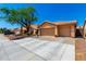 Beautiful home featuring a three-car garage, tile roof, and low-maintenance desert landscaping at 5912 W Gail Dr, Chandler, AZ 85226