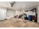 Large garage with three-car garage door and plenty of wall storage at 5912 W Gail Dr, Chandler, AZ 85226