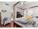 Main bedroom with a four-poster bed, hardwood floors, and a ceiling fan for a comfortable, inviting space at 5912 W Gail Dr, Chandler, AZ 85226
