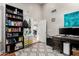 Office with built in bookshelves, desk, and gray patterned rug at 5912 W Gail Dr, Chandler, AZ 85226