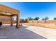Covered patio overlooking a spacious backyard with block wall, great for entertaining at 6320 S 26Th Dr, Phoenix, AZ 85041