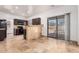 Kitchen with dark cabinetry, stainless steel appliances, and travertine flooring at 6320 S 26Th Dr, Phoenix, AZ 85041