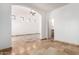 Open living space with travertine flooring, arched entryway, and lots of light at 6320 S 26Th Dr, Phoenix, AZ 85041