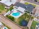 Aerial view of a backyard featuring a pool, covered patio, firepit and well-maintained landscaping at 6608 E Lewis Ave, Scottsdale, AZ 85257