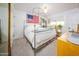 Comfortable bedroom with a four-poster bed, carpeted floors, and ample natural light at 6608 E Lewis Ave, Scottsdale, AZ 85257