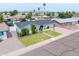 Charming single-story home with manicured lawn and desert landscaping enhancing curb appeal at 6608 E Lewis Ave, Scottsdale, AZ 85257