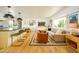 Bright, open-concept living room features hardwood floors, large windows, and neutral decor at 6608 E Lewis Ave, Scottsdale, AZ 85257