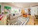 Inviting living room with a contemporary rug, comfortable seating, and natural light at 6608 E Lewis Ave, Scottsdale, AZ 85257