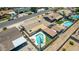 An aerial showcases a home’s outdoor living space with a pool and covered patio at 6838 E Belleview St, Scottsdale, AZ 85257