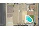 Aerial view of backyard with pool, patio, and updated landscaping at 6838 E Belleview St, Scottsdale, AZ 85257