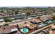 Stunning aerial view of residences with private backyard pools, lush landscaping, and streetscapes at 6838 E Belleview St, Scottsdale, AZ 85257