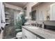 Modern bathroom with stone tile shower and granite vanity at 6838 E Belleview St, Scottsdale, AZ 85257