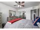 Bedroom featuring neutral walls, ceiling fan, light-colored wood floors, and a mirrored closet at 6838 E Belleview St, Scottsdale, AZ 85257