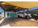 A covered carport featuring a vintage vehicle and providing shaded parking at 6838 E Belleview St, Scottsdale, AZ 85257
