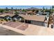 Inviting home showcasing desert landscaping and a classic suburban charm at 6838 E Belleview St, Scottsdale, AZ 85257