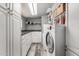 Laundry room featuring a washer and dryer, counter space, and built in storage cabinets at 6838 E Belleview St, Scottsdale, AZ 85257