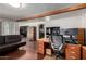Office with hardwood floors, modern lighting, large desk, and custom cabinets at 6838 E Belleview St, Scottsdale, AZ 85257