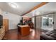 Spacious office with hardwood floors, modern lighting, large desk, and patio access at 6838 E Belleview St, Scottsdale, AZ 85257