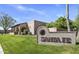 Santa Fe community sign with lush green lawn and well-maintained landscaping at 7673 N Via De Platina Dr, Scottsdale, AZ 85258