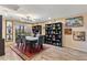Elegant dining room featuring a dining table, chairs, and bookshelves at 7673 N Via De Platina Dr, Scottsdale, AZ 85258