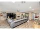 Bright living room featuring a fireplace, modern furnishings, and sliding glass doors at 7673 N Via De Platina Dr, Scottsdale, AZ 85258